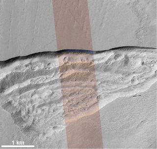 This high-resolution HiRISE image shows an icy scarp on Mars in the context of a broader area.