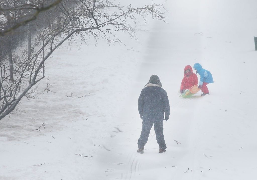 As the Northeast gets pummeled by a blizzard on Tuesday, March 14, 2017, kids take to the streets of Brooklyn for some sledding.