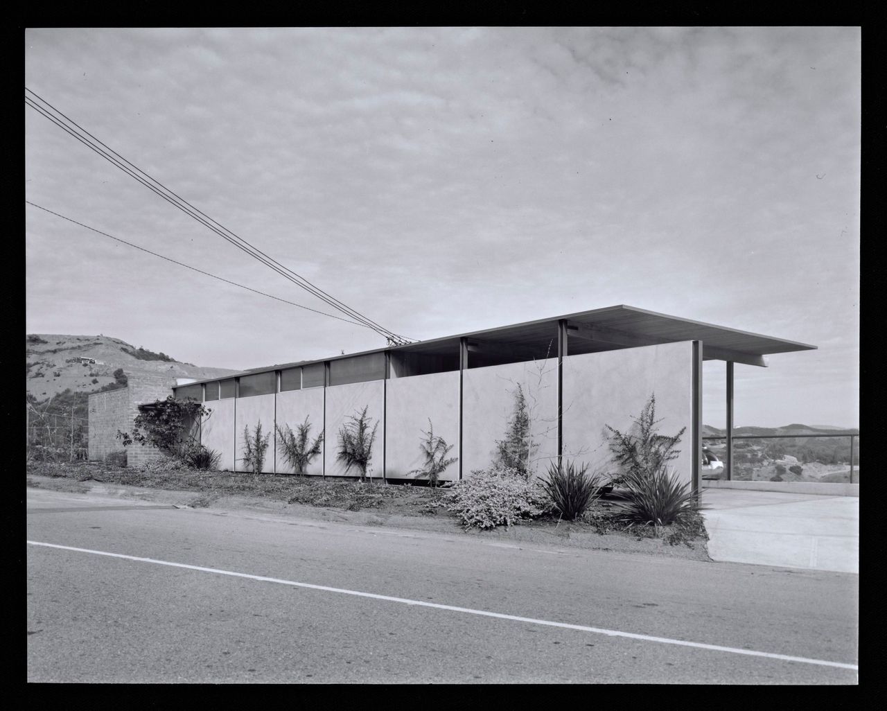 A view of the exterior of a modernist home in Crestwood Hills, Los Angeles