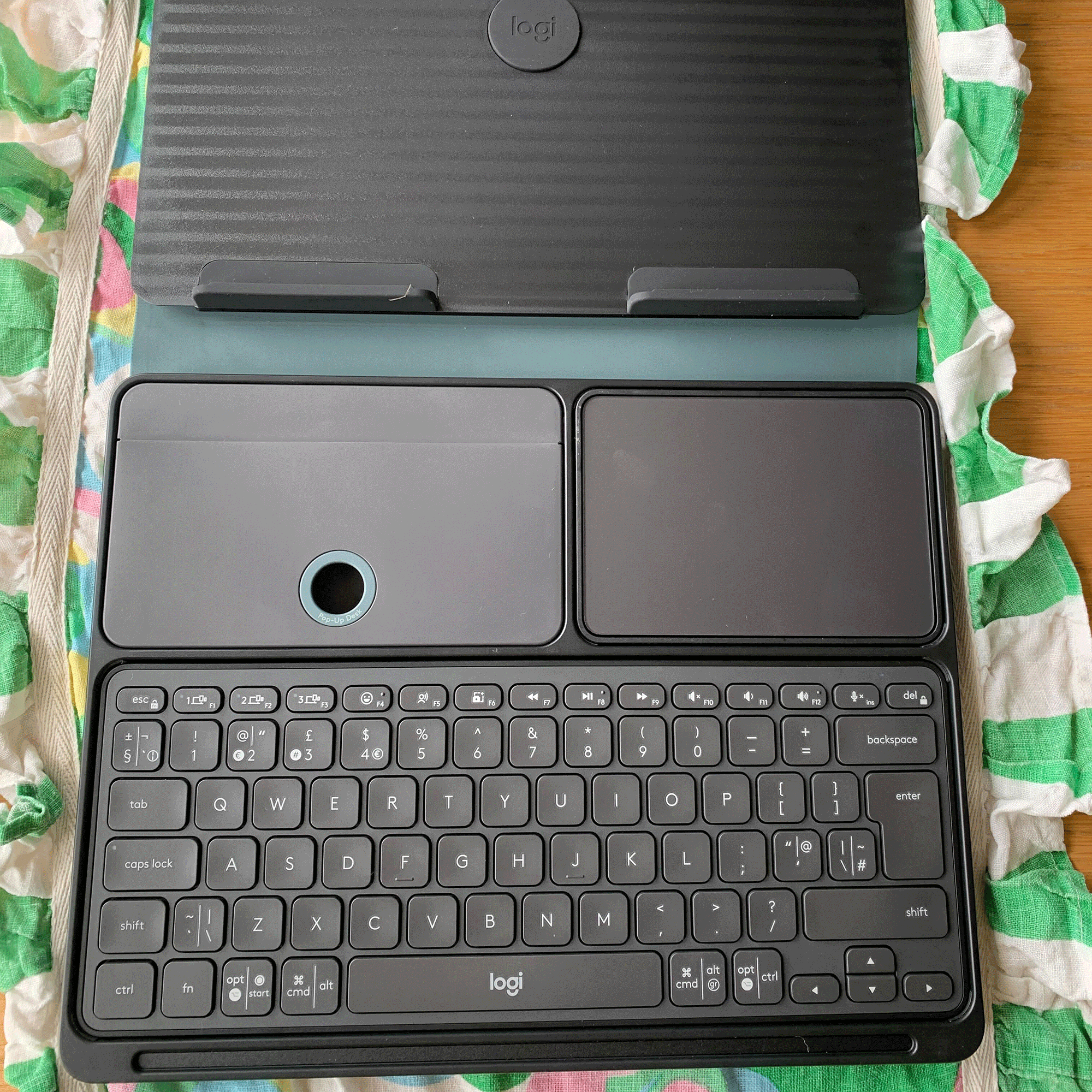 Green logitech pop up desk open