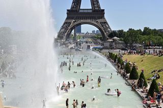 People cooling down by the Eiffel Tower.