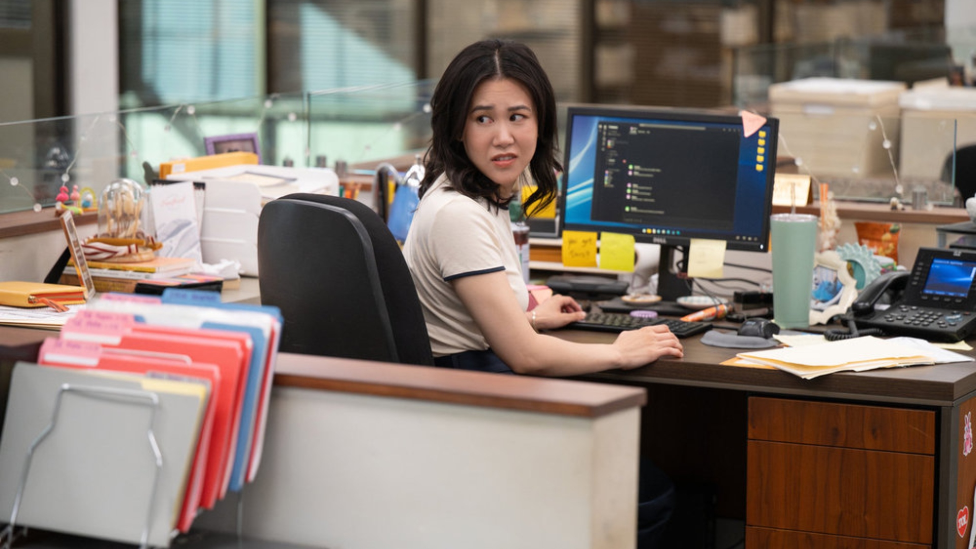 Nicole sits at her desk in The Paper season 1