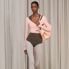 Ferragamo model wearing pink top and green leotard