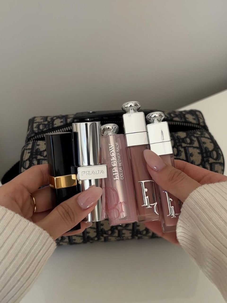 An image showing @leatngu holding various lip products