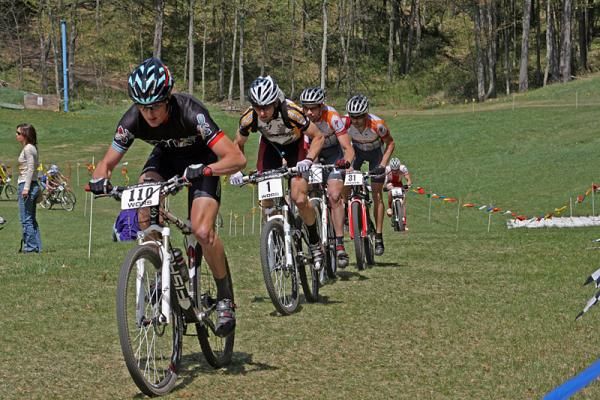 Mike Anderson (Gary Fisher 29er / SRAM; #110), Brian Matter (Gear Grinder / Trek; #1), Darrin Braun and Chris Pearison (Adventure 212) chase through the ski jump bowl during the first lap of the Iola Bump &amp; Jump.