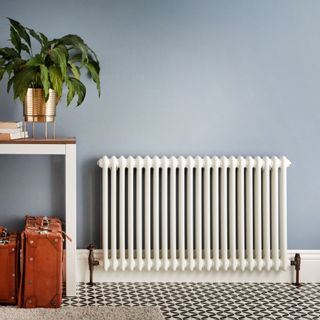 room with blue coloured wall and radiator