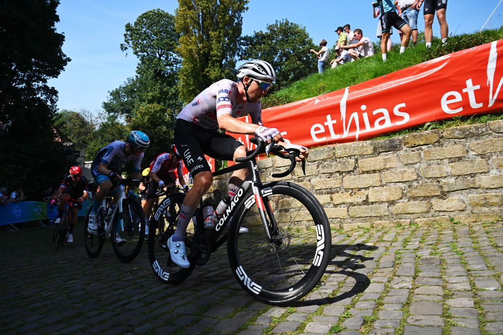 GERAARDSBERGEN BELGIUM SEPTEMBER 01 Tim Wellens of Belgium and UAE Team Emirates competes climbing the Muur van Geraardsbergen while fans cheer during the 20th Renewi Tour 2024 Stage 5 a 2027km stage from Menen to Geraardsbergen UCIWT on September 01 2024 in Geraardsbergen Belgium Photo by Luc ClaessenGetty Images