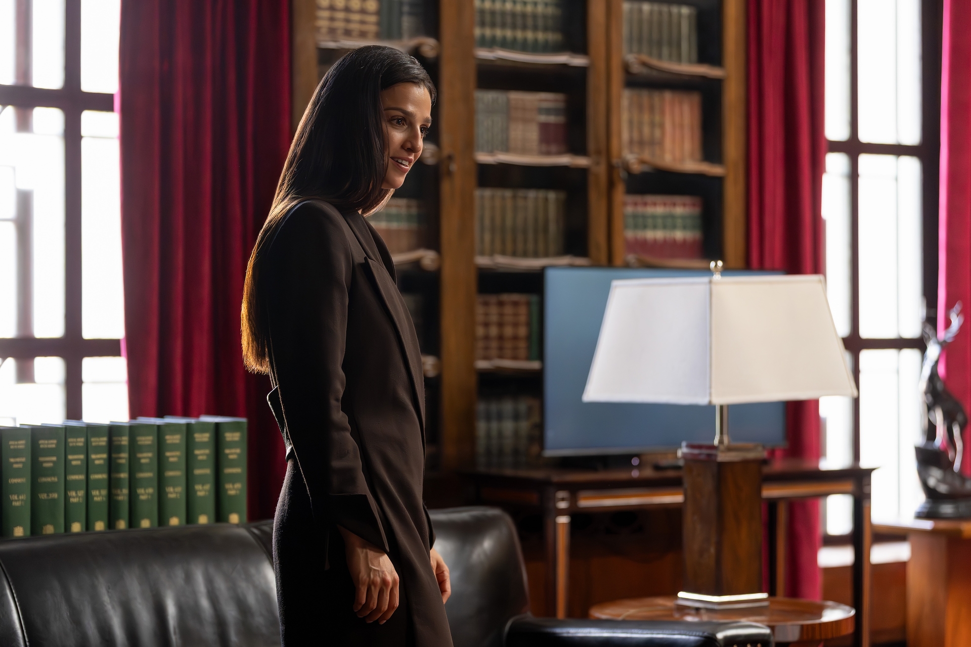 marisa abela as yasmin standing in a library office in industry season 4