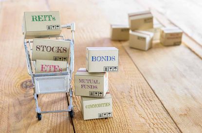 Cartons of financial investment products in a shopping cart i.e REITs, stocks, ETFs, bonds, mutual funds, commodities. A concept of portfolio management with risk diversification for optimal 