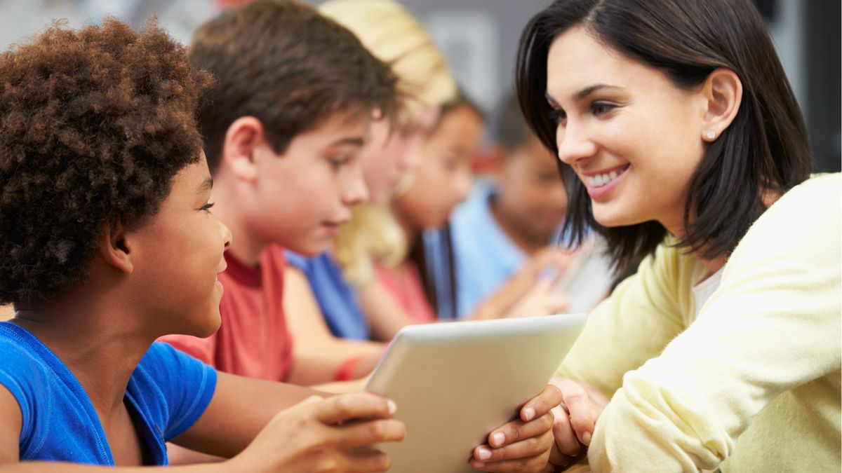 Teacher with learners in classroom