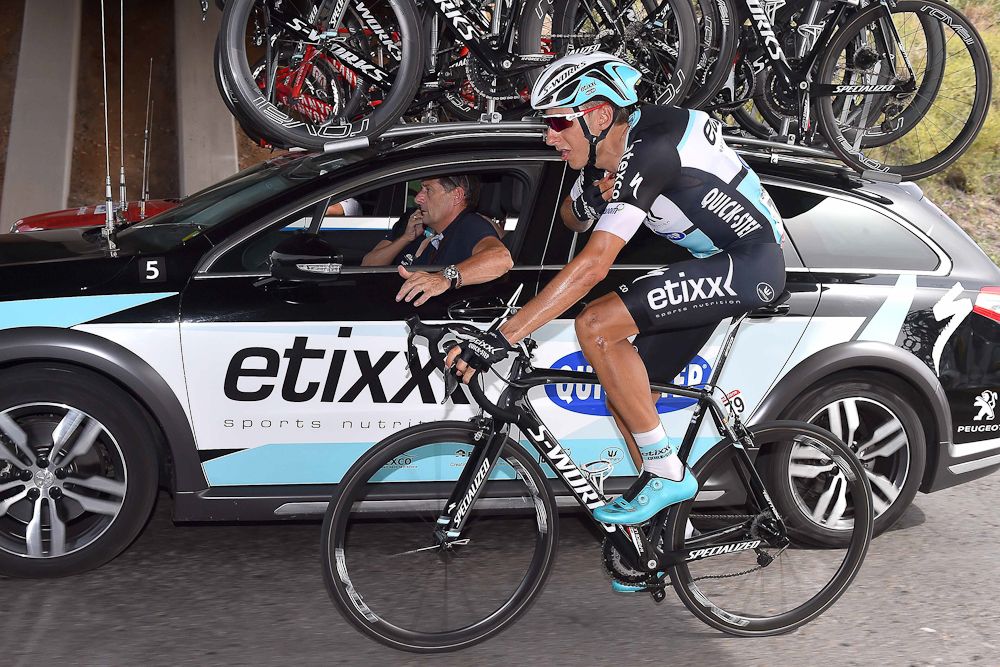 A Tinkoff rider chats with the team car.