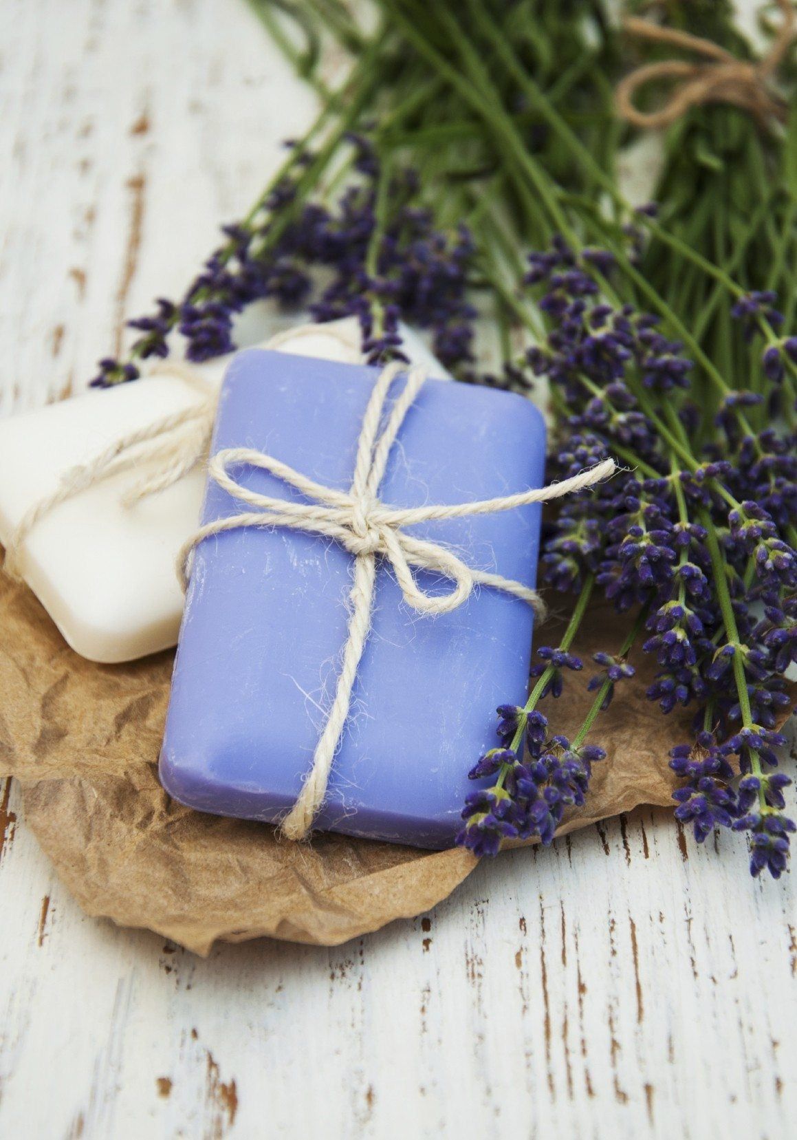 White And Purple Soap Next To Lavender Plants