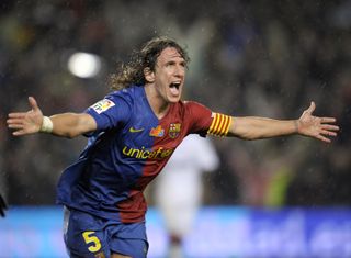 Carles Puyol celebrates after scoring for Barcelona against Real Madrid in 2008.