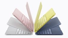 Four Apple MacBook Neos in different colours