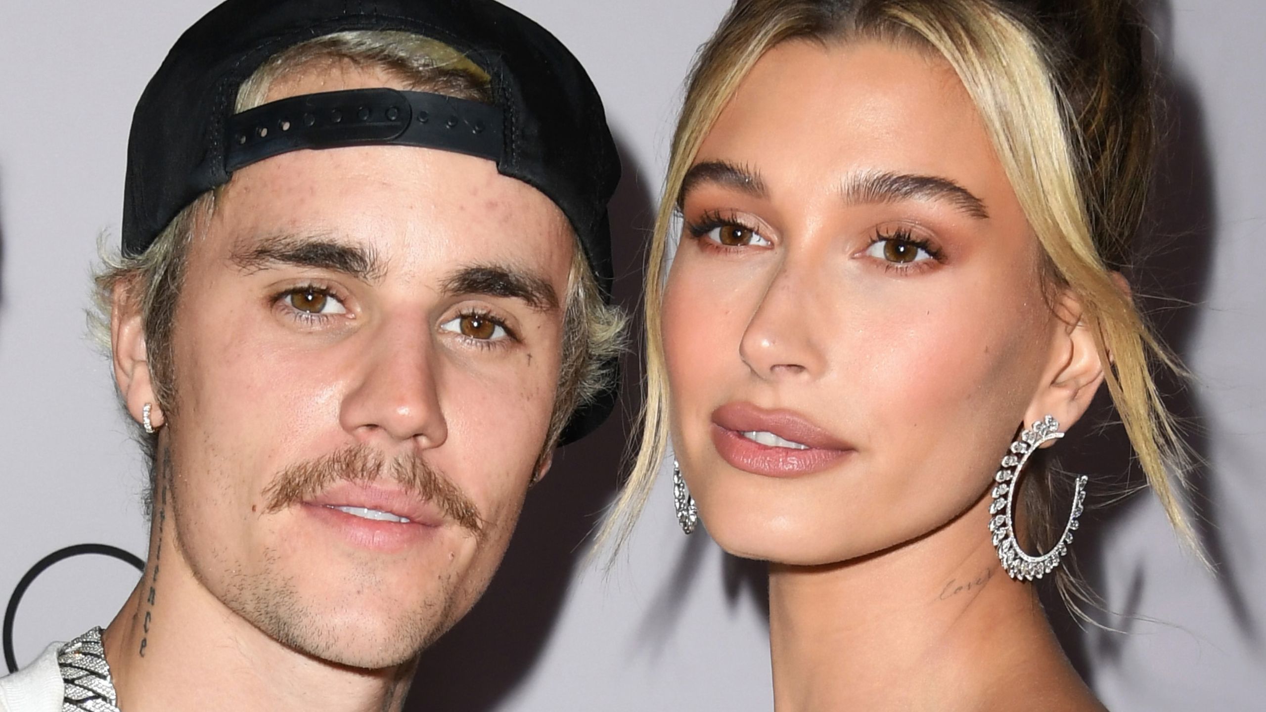 justin and hailey bieber on a white background