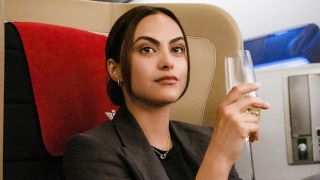 Ana Santos drinking champagne in airplane first class in Upgraded