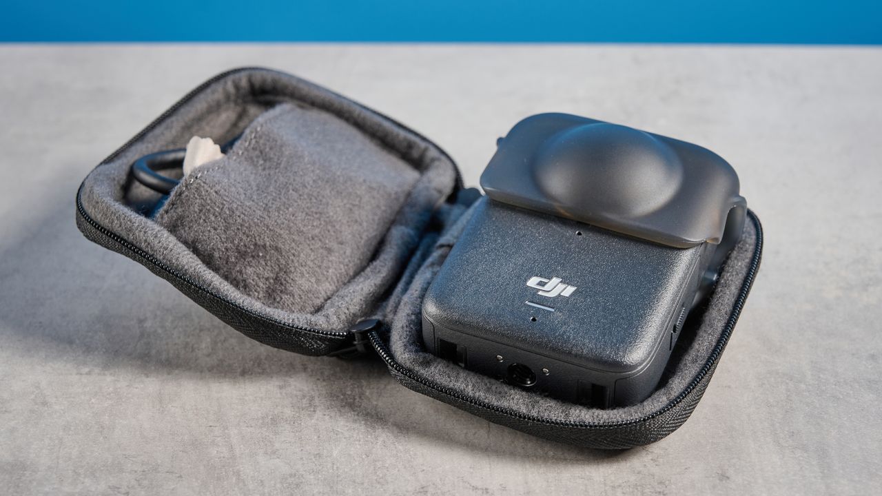 The DJI Osmo 360 in a protective case on a stone surface