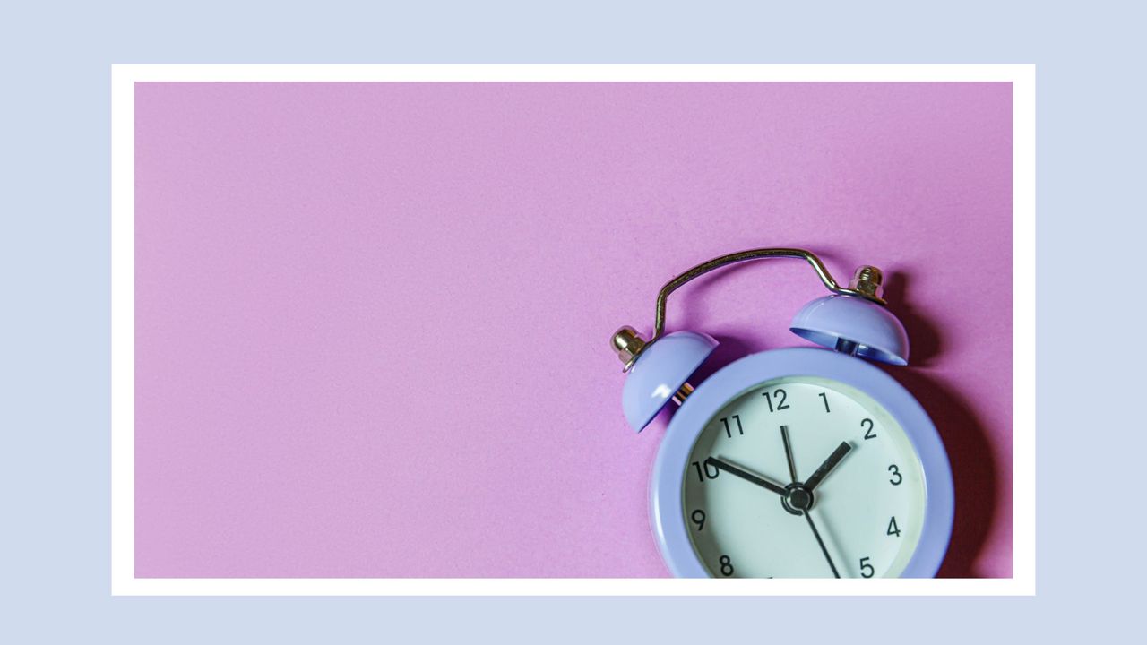 purple clock on a purple blackground