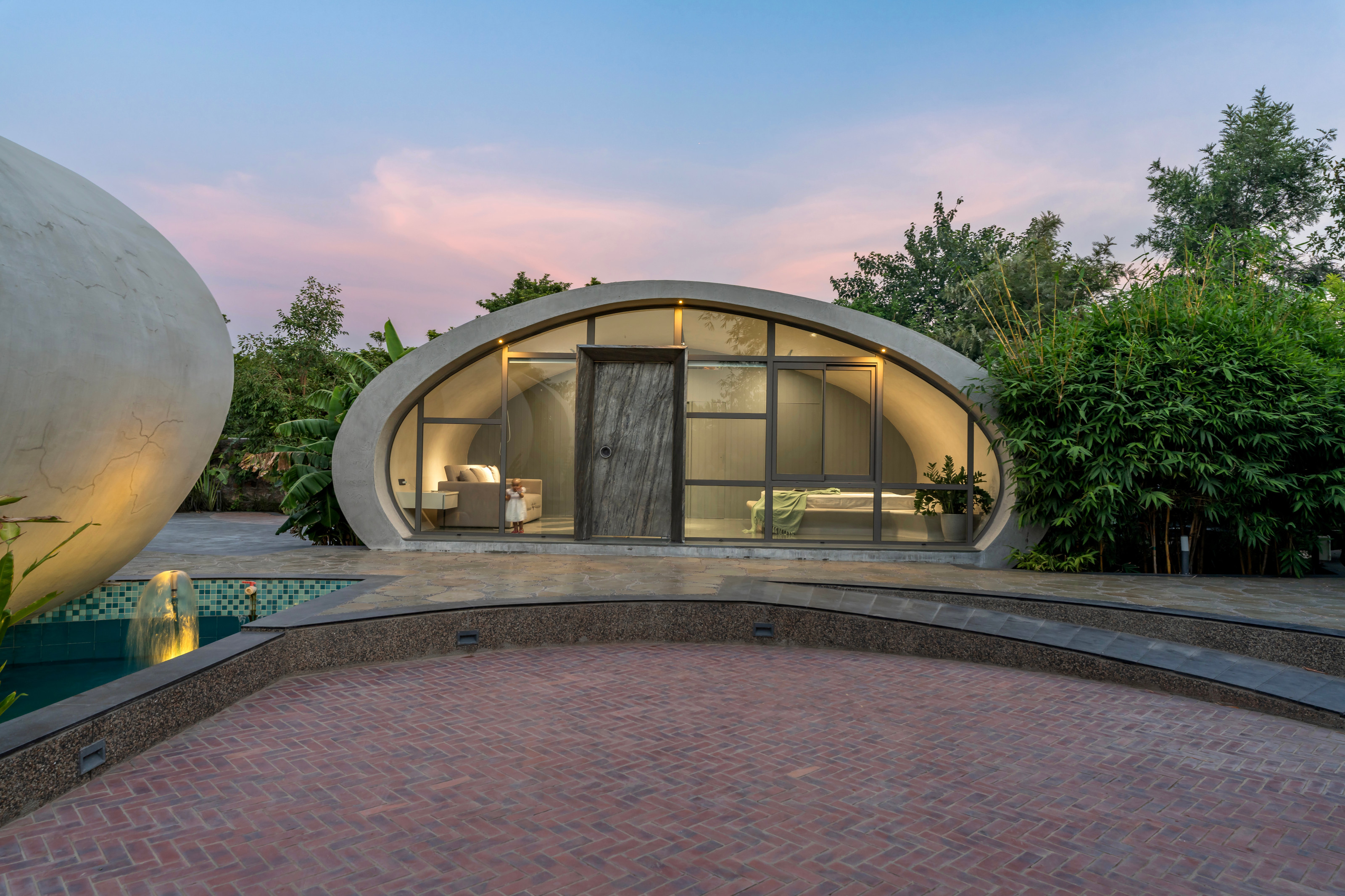 The bedrooms are housed in a small concrete structure alongside the main living areas