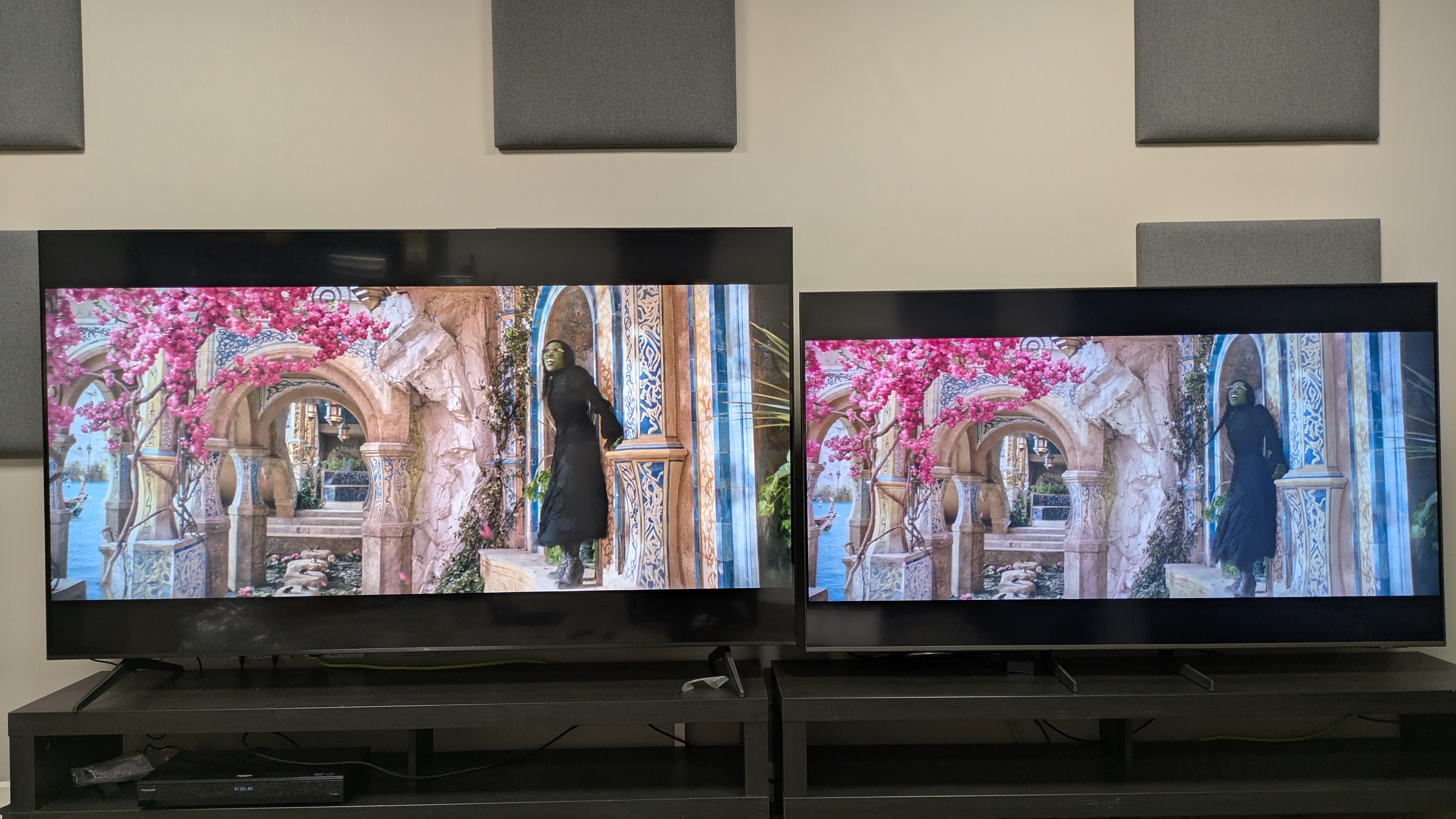 TCL Q6C (left) vs Samsung Q8F (right) showing Elphaba from Wicked on screen