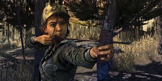 Clementine fires a bow in The Walking Dead.