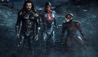 Aquaman, Cyborg, and The Flash standing on the battlefield in Zack Snyder's Justice League.