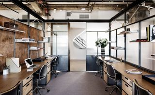 A private studio for working with custom-designed desks and swivel chairs