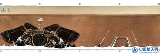 This panorama from China's Mars rover Zhurong shows the vast flat plain of its Utopia Planitia landing site. The rover's solar arrays and deck are visible at left and the wheel ramps on its lander can be seen at right.