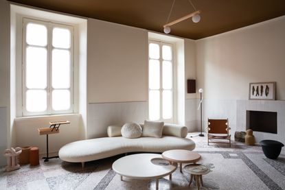 a living room with a brown painted ceiling