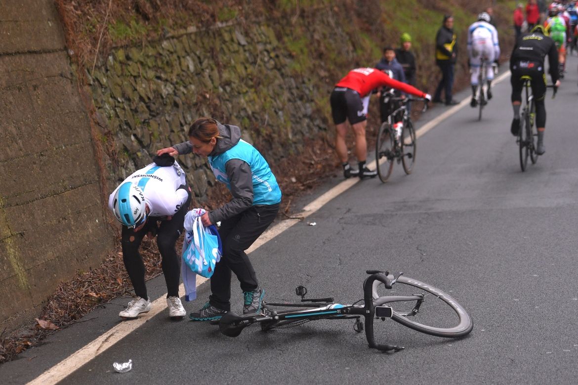 Lukas Wisniowksi (Team Sky) is helped up after a crash