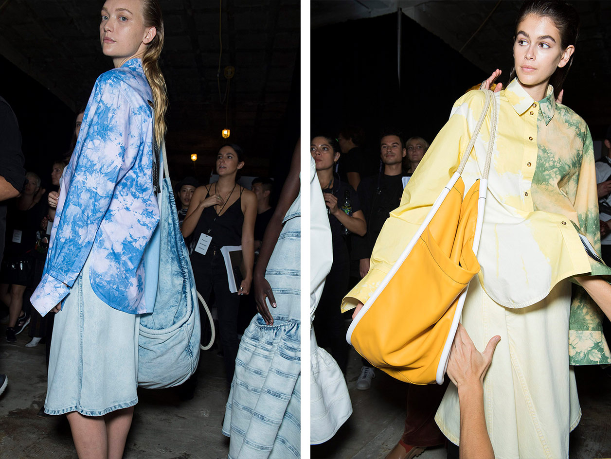 Models wear tie dye shirts with blue and yellow denim skirts