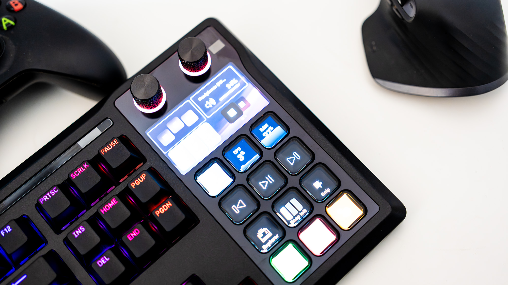 The Corsair Galleon 100 SD lit up with the Stream Deck side panel turned on and with various icons.