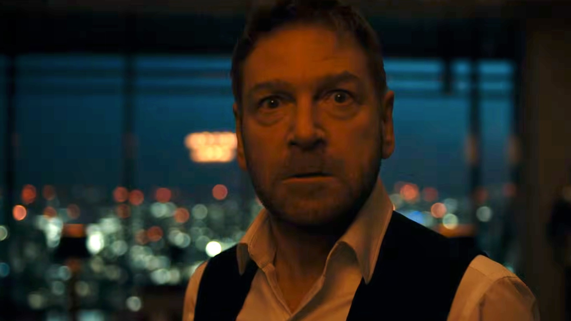 Kenneth Branagh in The Thomas Crown Affair, looking very mad and surprised.