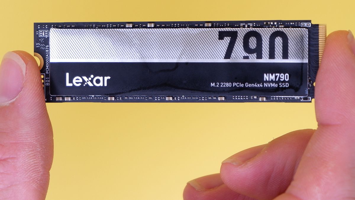 Lexar NM790 SSD on a yellow background with packaging.