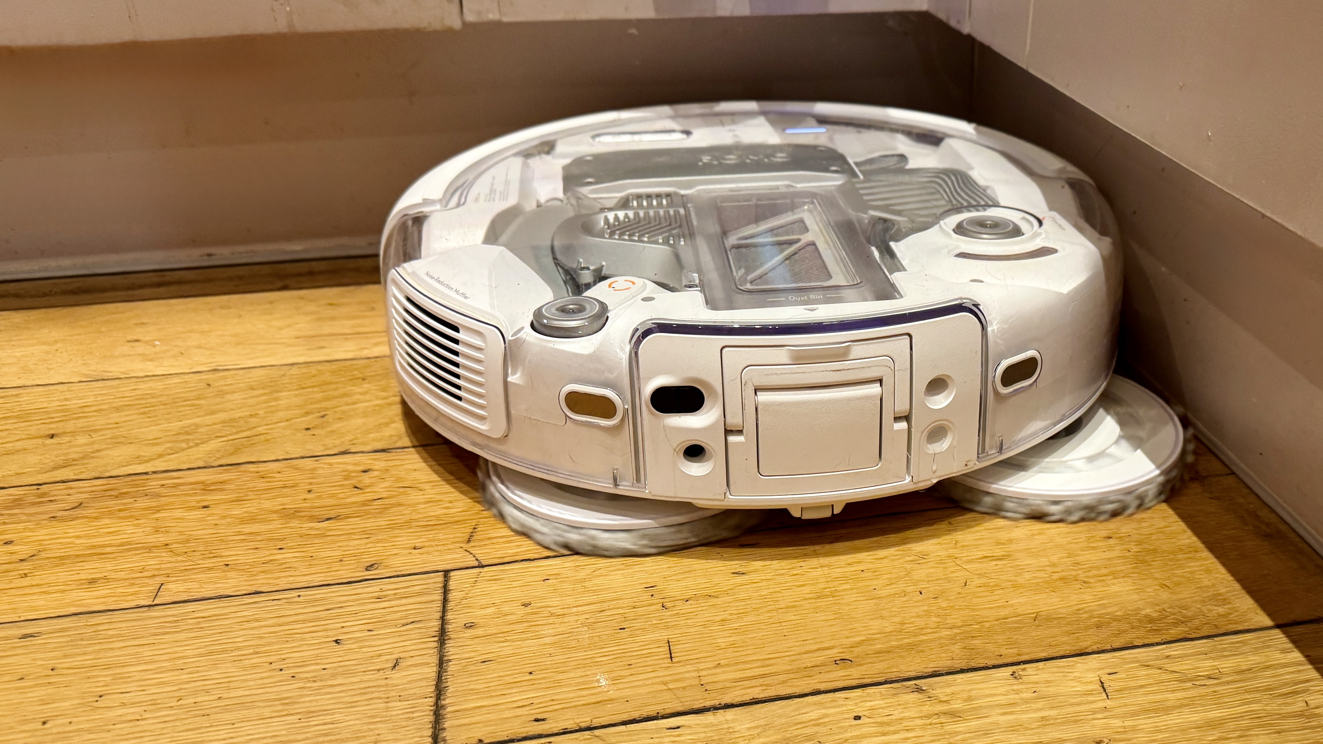 DJI Romo P robot vacuum mopping in a corner
