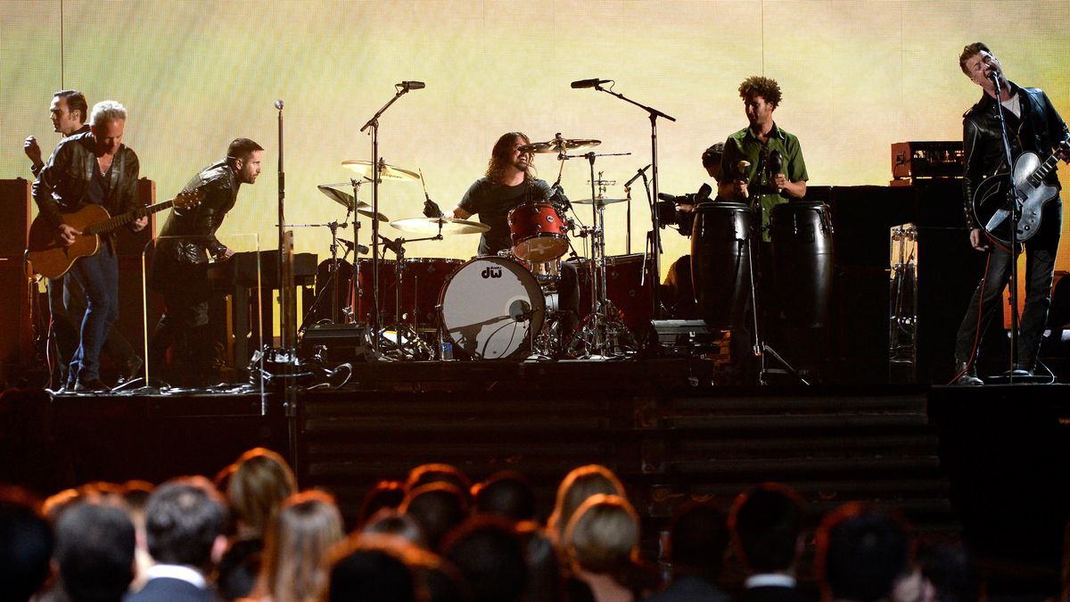 Musicians Dean Fertina, Lindsey Buckingham (of Fleetwood Mac), Trent Reznor (of Nine Inch Nails), Dave Grohl, and Josh Homme of Queens of the Stone Age perform onstage during the 56th GRAMMY Awards at Staples Center on January 26, 2014 in Los Angeles, California