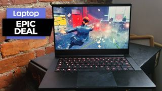 Razer Blade 14 gaming laptop on a black desk with brick wall background