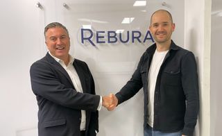 David Grant, CEO at Westcon-Comstor pictured shaking hands with Aaron Rees, Founder and CEO at Rebura. 