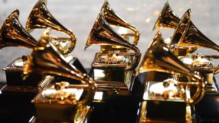 Eight Grammy Awards on a table