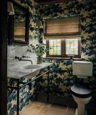 bathroom with botanical wallpaper