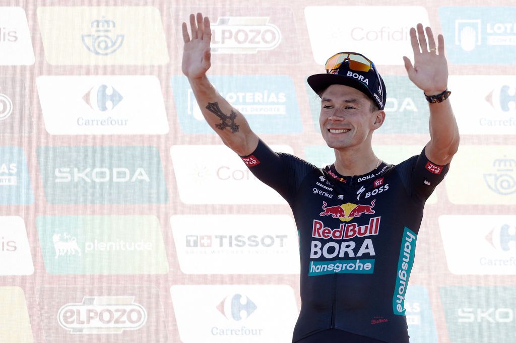 New overall ranking leader Team Bora&#039;s Primoz Roglic celebrates on the podium after winning the stage 4 of La Vuelta a Espana cycling tour, a 170.4 km race between Plasencia and Pico Villuercas, near the town of Navezuelas in Caceres province, on August 20, 2024. (Photo by OSCAR DEL POZO / AFP)