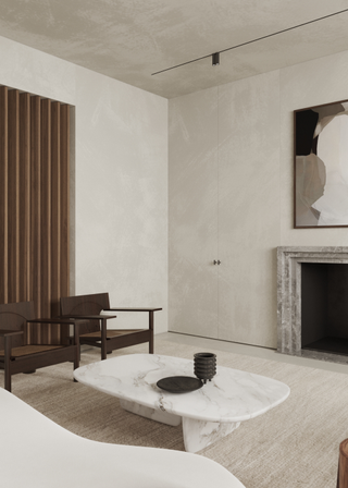 microcement living room, sleek and minimalist. A marble coffee table sits in the middle of the living room with two brown chairs.