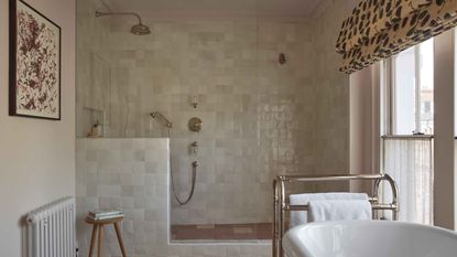 shower with zellige tiles and bath in the foreground