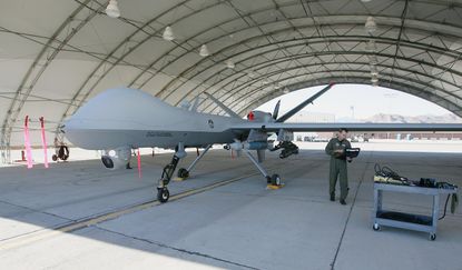 CREECH AIR FORCE BASE, NV - AUGUST 08: United States Air Force Maj. Casey Tidgewell gets an MQ-9 Reaper ready for a training flight August 8, 2007 at Creech Air Force Base in Indian Springs, 