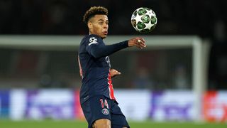 Desire Doue of Paris Saint-Germain looks at the ball during the UEFA Champions League 2024/25 Quarter Final First Leg match between Paris Saint-Germain and Aston Villa FC in April 2025