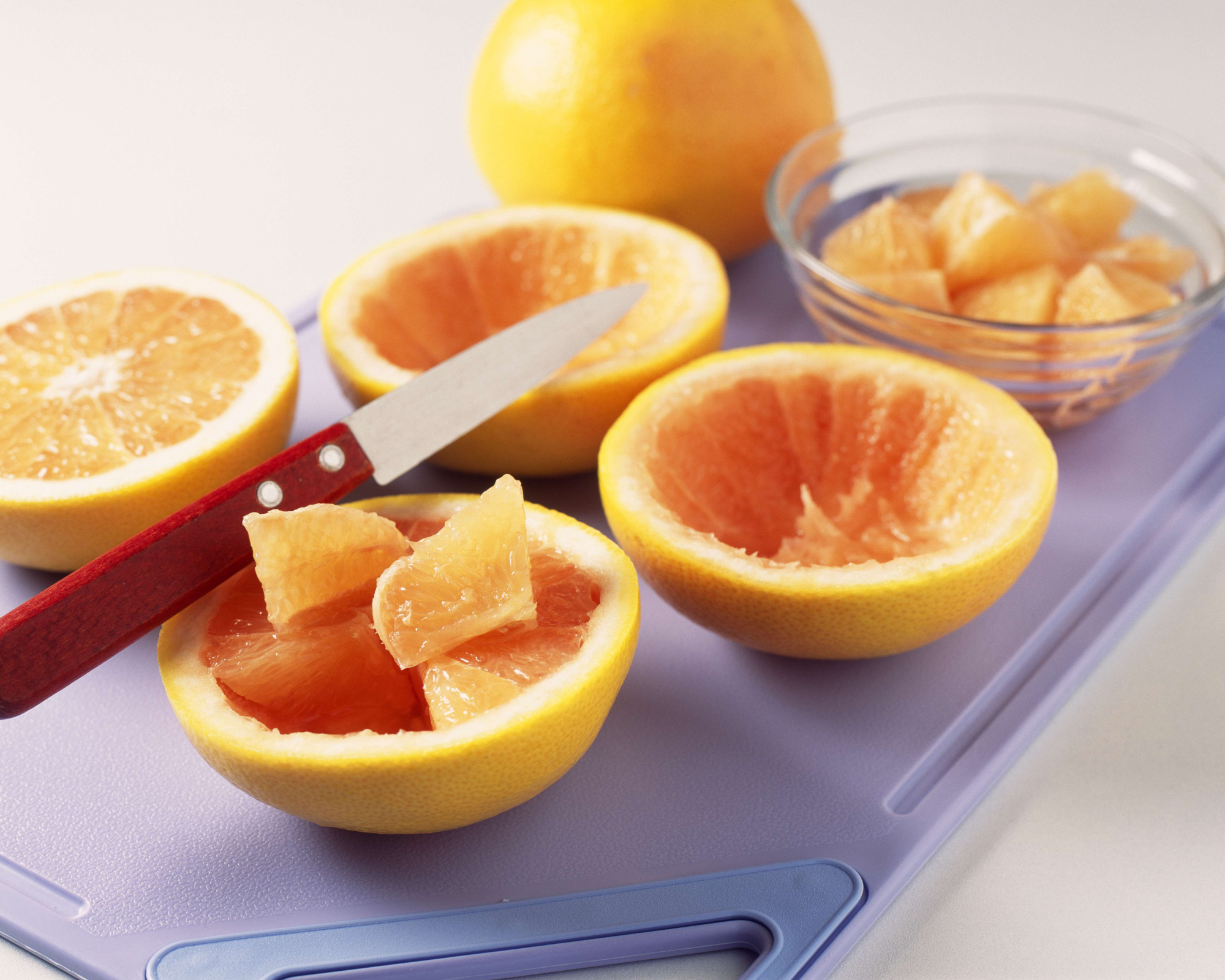 Hollowing out grapefruit to create grapefruit slug trap