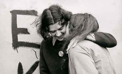 Ponch Hawkes, No title (Two women embracing, 'Glad to be gay') 1973; printed 2018 gelatin silver photograph, National Gallery of Victoria, Melbourne. Purchased NGV Foundation, 2018 © Ponch Hawkes, 2018
