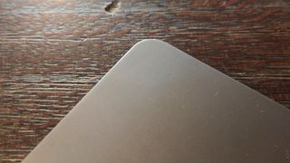 A SPace Grey Honor Pad 9 tablet on a brown table