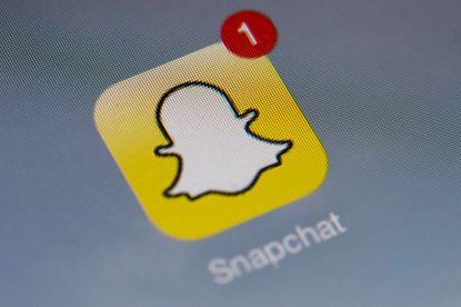 The Snapchat icon on a mobile phone