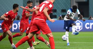 Bukayo Saka puts England 4-0 up against Iran at World Cup 2022: Bukayo Saka of England scores their team's fourth goal during the FIFA World Cup Qatar 2022 Group B match between England and IR Iran at Khalifa International Stadium on November 21, 2022 in Doha, Qatar.